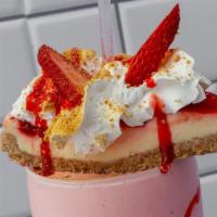 Strawberry Cheesecake Shake (16 Oz.) · Strawberry cheesecake shake, whipped cream, cheesecake bread crumbs, and cheesecake on top.