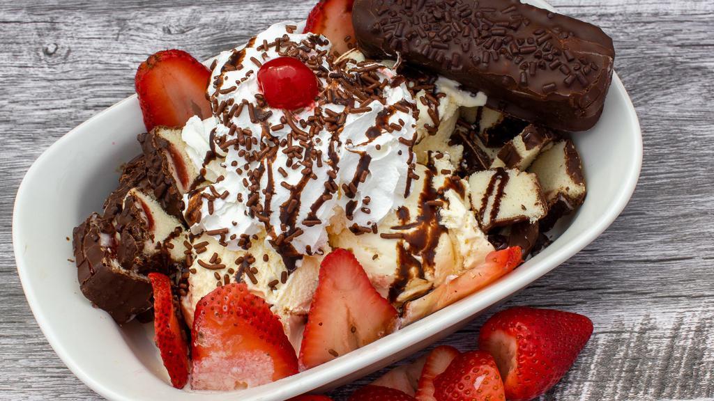 Gansito Dulce (16 Oz.) · Gansito, three scoops of ice cream strawberries, chocolate drizzle, chocolate sprinkles, whipped cream and a cherry on top.