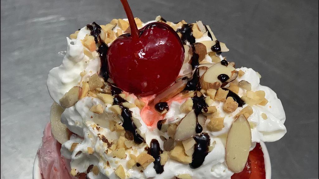 Banana Royal · Two scoops of ice cream, whipped cream, chocolate or caramel syrup, banana, and a cherry on top.