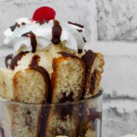 Dulce Bimboyo · Bimboyo, three scoops of ice cream, banana, whipped cream, chocolate drizzle, and a cherry o...