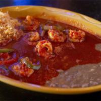 Camarones A La Diabla · Jumbo shrimp in a special spicy sauce served with rice and beans.