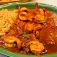 Camarones A La Tampiquena · Jumbo shrimp in a special red sauce served with rice and beans.