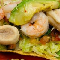 Tostada De Camaron Y Abalone · Tostada with diced tomatoes, onion, and cucumber shrimp and abalone.