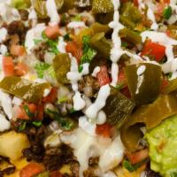 Crazy Fries  · Whit meat cheese jalapeño guacamole and sour cream