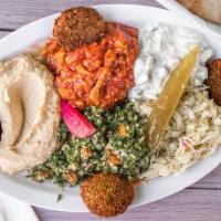 Combo Salad · Includes five sides, four falafel balls and pita bread.