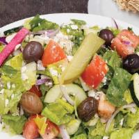 Greek Salad · Includes cucumbers, onions, tomatoes, olives, feta cheese with vinaigrette.