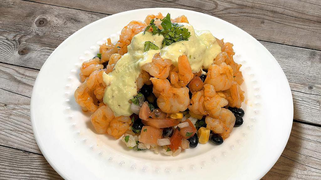 Shrimp & Cilantro Rice · Gluten-Free, Dairy-Free, Freezable. A generous portion of beautifully seasoned shrimp with a mix of black beans, corn and pico de gallo, over our lime-cilantro brown rice, served with fresh, house-made, avocado dressing.