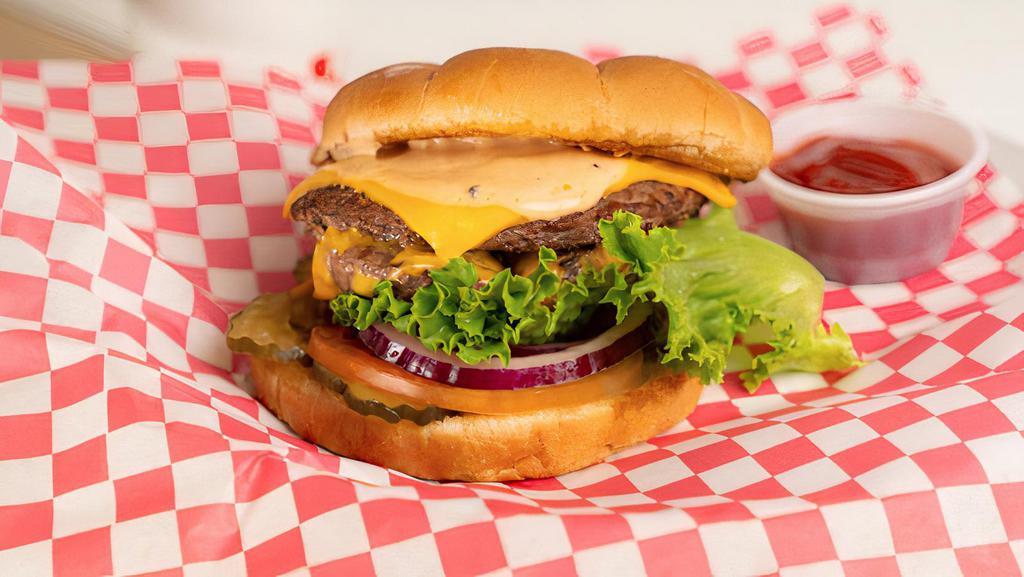 Double Burger · Two 1/4 lb. Fresh Beef Patties, Lettuce, Tomato, Pickles, American Cheese, and a Thousand Island Dressing.
