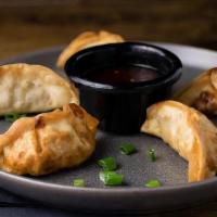 Gyoza · Fried pork and vegetable dumplings, served with a gyoza dipping sauce.