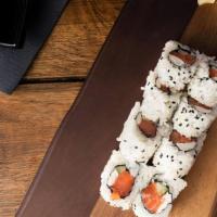 Philadelphia Roll · Salmon, avocado, and cream cheese with sushi rice wrapped in nori.