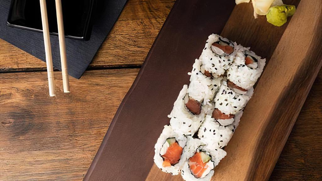 Philadelphia Roll · Salmon, avocado, and cream cheese with sushi rice wrapped in nori.