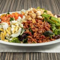 Cobb Salad · Mixed greens, bacon, hardboiled egg, chicken, avocado, tomatoes, with Blue cheese crumbles.