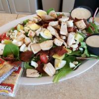 Chicken Caesar Salad · Tender strips of grilled chicken tossed with Romaine, Parmesan cheese, croutons
and Caesar d...