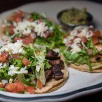 Taco Trio · Mini soft tacos- grilled chicken, carne asada and grilled shrimp. Served with lettuce, jack ...