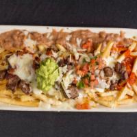 Carne Asada Fries · Fries with carne asada in red chili sauce. Served with pico De gallo , guacamole, and sour c...