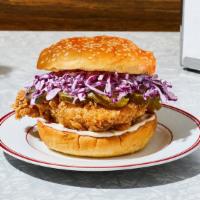 The Classic Fried Chicken Sandwich · Our signature fried chicken served on a toasted bun and topped with pickles and mayo.