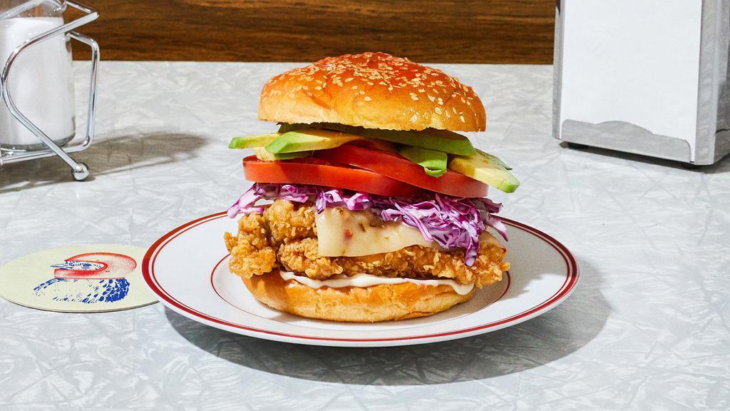 The Southwestern Fried Chicken Sandwich · Our signature fried chicken served on a toasted bun and topped with pepper jack cheese, red cabbage slaw, tomato, avocado, and mayo.