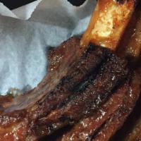 Brandon The Banker · 4 Beef ribs. Served with your choice of 2  sides &  bread.