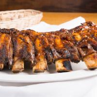 Big Vaca Platter · Full slab of beef ribs (7 ribs) with 2  sides  & bread.