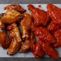 25 Wings · 25 bone-in wings tossed in your choice of up to two flavors.