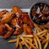 10 Piece Wing Combo · Make it a combo! 10 bone-in wings tossed in your choice of up to two flavors, house seasoned...