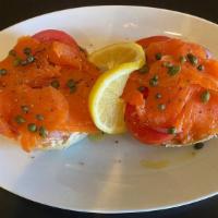 Salmon Bagel · Choice of bagel topped with cream cheese, smoked salmon, capers, red onions, tomatoes, salt,...