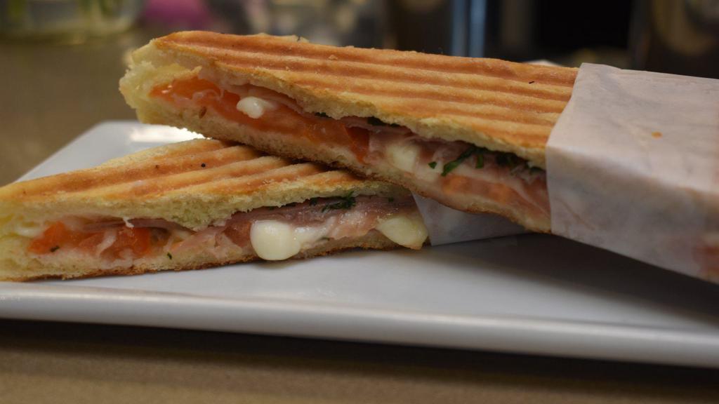 Prosciutto & Mozzarella · Prosciutto, fresh mozzarella, tomatoes, basil & olive oil pressed in ciabatta bread