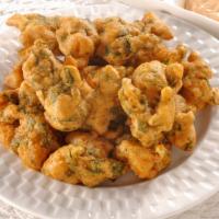 Pakora Vegetables · Vegetarian. Delicious onions, cauliflower, potatoes and spinach coated in garbanzo batter an...
