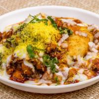 Aloo Tikki Chaat · Vegetarian. Potato patty topped with chickpeas, yogurt, tamarind, and mint chutney finished ...