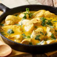 Chicken Korma · Delicious mildly spiced and prepared with yogurt, spices, curry sauce and nuts.