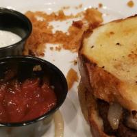 Patty Melt · 1/2 pound C.A.B. burger topped with sautéed onions and swiss cheese served on a grilled rye ...
