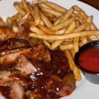 Junction Rib Tips · Six piece meaty tender tips tossed in our famous BBQ sauce served over a bed of fries.