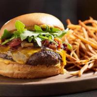 Sullivan'S Signature Beef Burger · Beef, Cheddar, Lettuce, Tomato, Pickle Sauce, Brioche Bun, Roasted Garlic Parmesan Fries