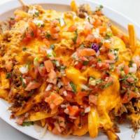 Carnitas Fries · Our crispy french fries topped with carnitas, cheese and pico de gallo.