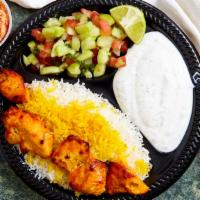 Chicken Kabob · Grilled chicken breast served with fresh baked bread steamed basmati rice and salad.