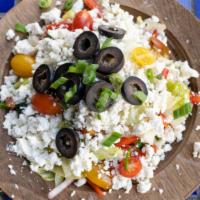 Greek Twist · Feta cheese, spinach, black olives, cherry tomatoes, lettuce, cucumber, onion, balsamic dres...