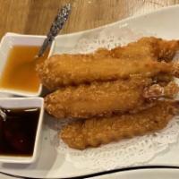 Shrimp Tempura (5 Pcs) · Batter-fried shrimp served with sweet and sour sauce.