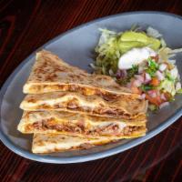 Quesadilla · Choice of meat and cheese between two large flour tortillas.