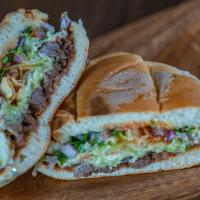 Torta · Choice of meat, beans, jack cheese, lettuce, pico de gallo, sour cream and salsa served betw...