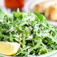 Arugula Salad · Fresh arugula, tossed with shaved Parmesan cheese, pine nuts and avocado. Paired excellently...