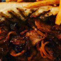 Tri-Tip Sandwich · Topped with BBQ sauce and grilled onions. Served with fries and fruit.