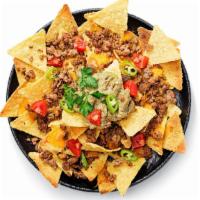 Nachos · Crispy tortilla chips covered with cheese and your choice of meat.