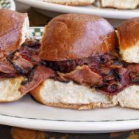 Shaved Pastrami Sliders · Swiss cheese, pickle, barney’s sauce. Three per order.