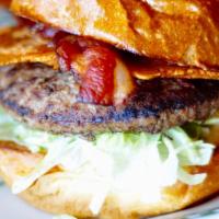 Cali Burger · 1/3 lb burger, spicy guacamole, bacon, cheddar cheese, jalapeño, lettuce, barney's sauce. Se...