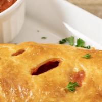 Pepperoni Calzone · mozzarella cheese and pepperoni, with a side of marinara.