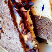 Pastrami Reuben Sandwich · Served on marbled rye loaf. Sauerkraut, Swiss, 1000 island.   (this item does not come with ...
