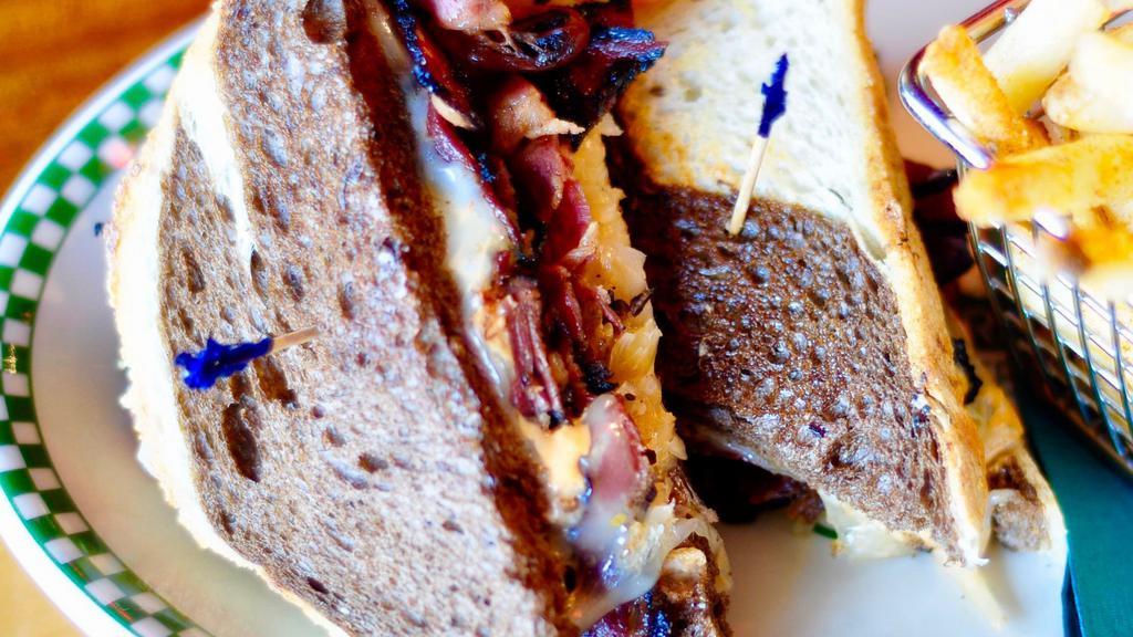 Pastrami Reuben Sandwich · Served on marbled rye loaf. Sauerkraut, Swiss, 1000 island.   (this item does not come with a side)