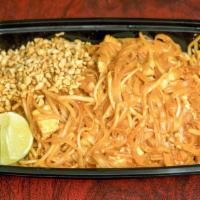 Pad Thai · Stir-fried rice noodles with eggs, tofu, bean sprouts, garnished with ground peanuts and lim...