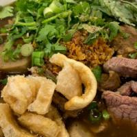 Boat Noodle · Rice noodle soup served with sliced beef, meatballs, and tripe in a sweet soy sauce-based br...