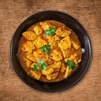 United Chicken Curry  · (16 Oz.) Tender morsels of chicken cooked in a classic brown curry with Indian whole spices.